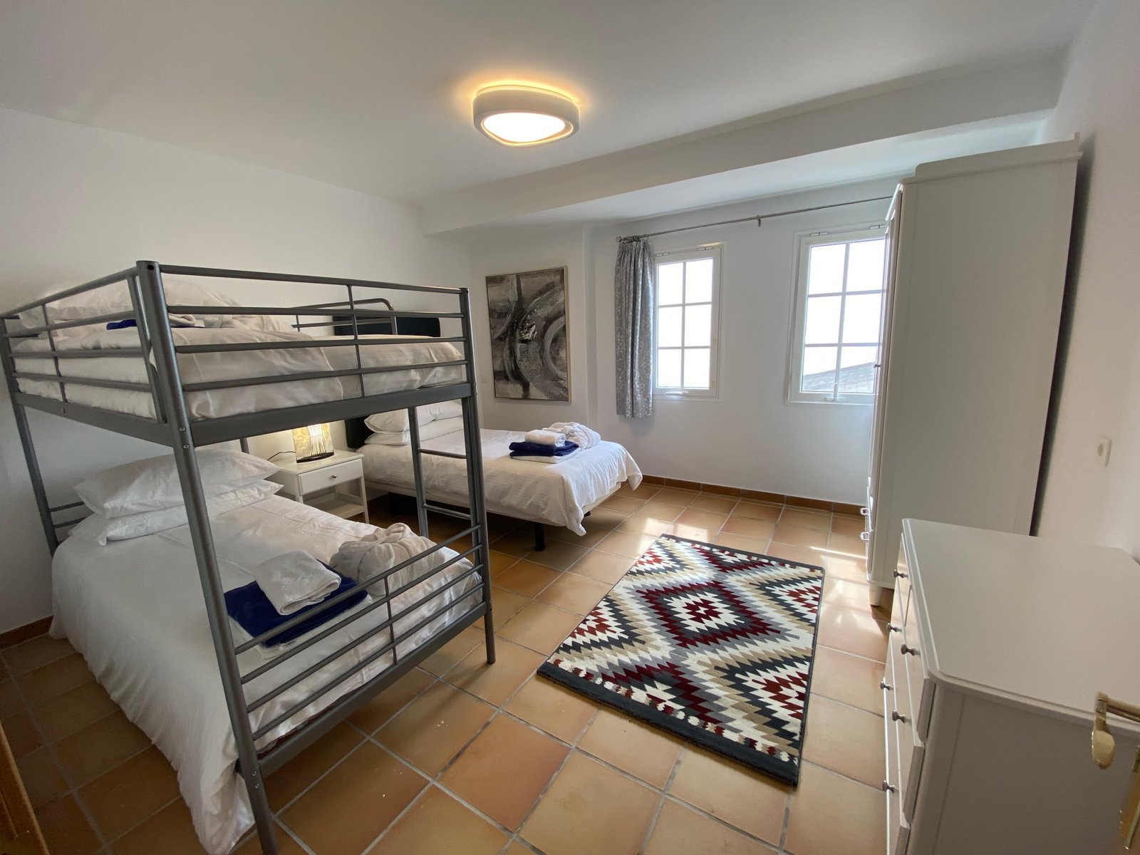 triple room - one single bed and a set of bunk beds